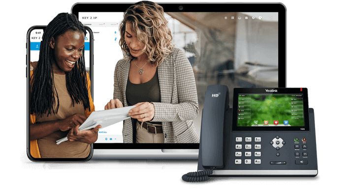Key 2 IP video meeting on a laptop and smartphone, with a desk phone